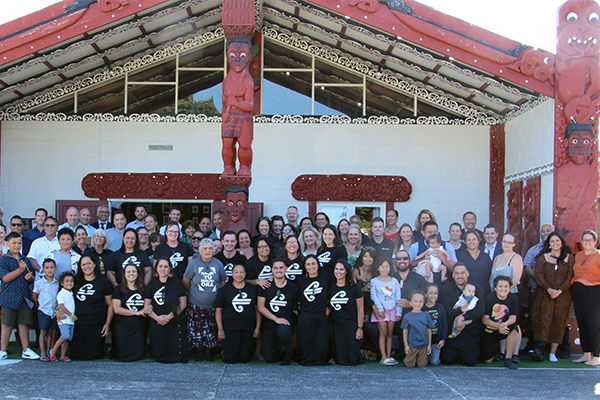 Air New Zealand staff in front of a Marae